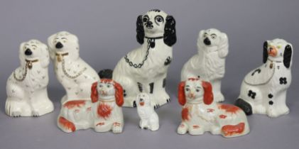 Eight seated spaniel ornaments; a collection of beer steins; & various other items of decorative