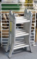 A Homebase aluminium multi-purpose ladder; together with a toddler’s safety-gate.