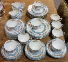 A Crown Staffordshire bone china floral decorated fifty-one piece part tea service with blue