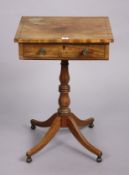 A 19th century inlaid-mahogany work table with a rectangular top, fitted frieze drawer, & on a