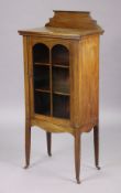 An Edwardian mahogany small china display cabinet fitted two shelves enclosed by a glazed door, & on