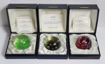 Four Caithness glass paperweights; together with four other glass paperweights, boxed & unboxed.
