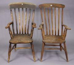 Two late 19th/Early 20th century lath-back elbow chairs each with a hard seat, & on turned legs with