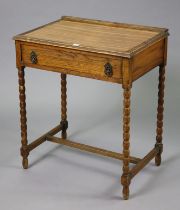 A 1930’s small oak side table fitted with a frieze drawer & on bobbin-turned legs, 68.5cm wide x