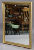 Another large gilt frame rectangular wall mirror with a beaded edge & raised foliate border, & inset