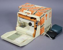 A Frister & Rossmann “Cub 3” electric sewing machine, boxed.