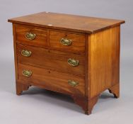 A mahogany dwarf chest fitted two short & two long drawers with brass swing handles, & on bracket