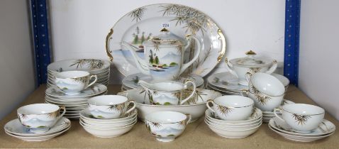 A Japanese porcelain fifty-two piece part dinner & tea service of white ground & with river