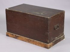 An early 20th century stained deal blanket box with a hinged lift-lid, & with wrought-iron side