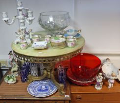 A china floral encrusted table candelabra; a similar oval bowl; a set of Minton’s china coffee cans;