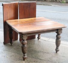 A late Victorian oak extending dining table – 2 leaves (w.a.f.) & a similar set of 10 carved oak