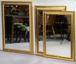 Three gilt frame rectangular wall mirrors.