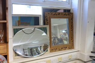 A gilt frame rectangular wall mirror, 71cm x 61cm; a frameless oval wall mirror, 46cm x 60cm; & thre