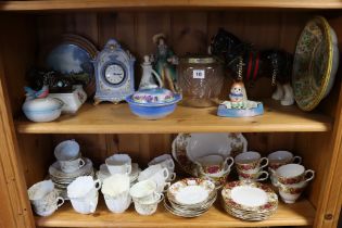 A pair of Staffordshire pottery seated spaniel ornaments, 26cm high; various part tea services; &