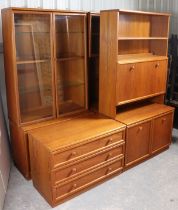 A G-Plan teak inter-changeable tall wall unit fitted with an arrangement of cupboards, drawers,