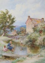 FREDERICK JAMES KNOWLES (1874-1931). A rural landscape with mother & child beside a stream,