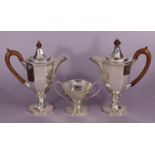 A George V silver café au lait set of eight-sided vase shape comprising a coffee pot and hot-milk