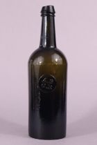 A 19th century All Saints Common Room glass wine bottle, with seal stamp “A.S.C.R”, 30cm.