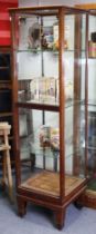 A similar mahogany glazed display cabinet, fitted three adjustable glass shelves, with parquetry-