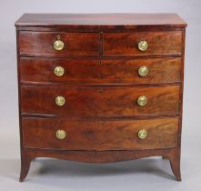 An early 19th century mahogany bow-front chest fitted two short & three long graduated drawers