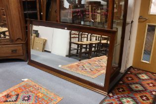 A large mahogany frame rectangular wall mirror inset bevelled plate with moulded borders, 180cm wide
