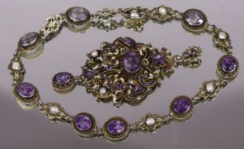 A white metal necklace set simulated amethysts & blister pearls; & a similar renaissance-style large