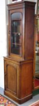 An early Victorian mahogany narrow bookcase, fitted three adjustable shelves to the upper part