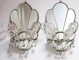 A pair of 1930s Art Deco fan-shaped mirrored wall sconces, each holding moulded glass spiral canes