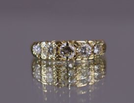 A five-stone diamond ring, the graduated round brilliant-cut stones with combined weight of