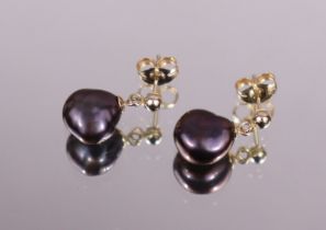 A pair of black baroque pearl drop earrings, the yellow metal mounts marked “375”; 1.8gm.