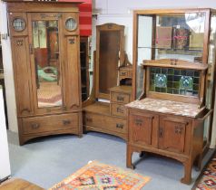 An early 20th century Liberty & Co. oak three-piece bedroom suite with oxidised copper art nouveau