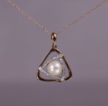 A pearl & diamond pendant of open triangular form, the central culture pearl set within a border