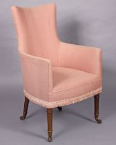 A Victorian armchair with padded seat, rounded back & square arms upholstered pink fabric, on turned
