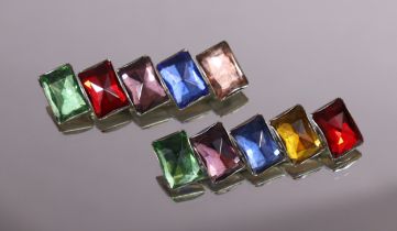 A pair of early/mid-20th century bar brooches, each with four differently-coloured rectangular paste