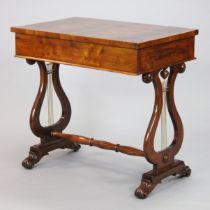A Regency mahogany and fruitwood small writing table with lyre-shaped end supports & brass mounts,