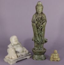 A 20th century Chinese carved soapstone figure of Guanyin, 34cm; & two other stone carvings of