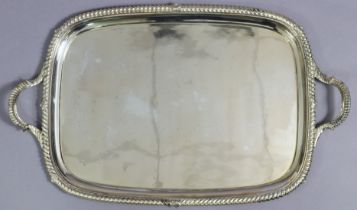 An Elkington & Co. silver-plated large rectangular two-handled tray with gadrooned rim; 74cm x