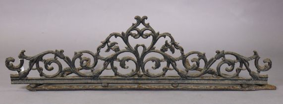 A Georgian cast-iron architectural cornice of foliate scroll design, on bun feet with rail base,