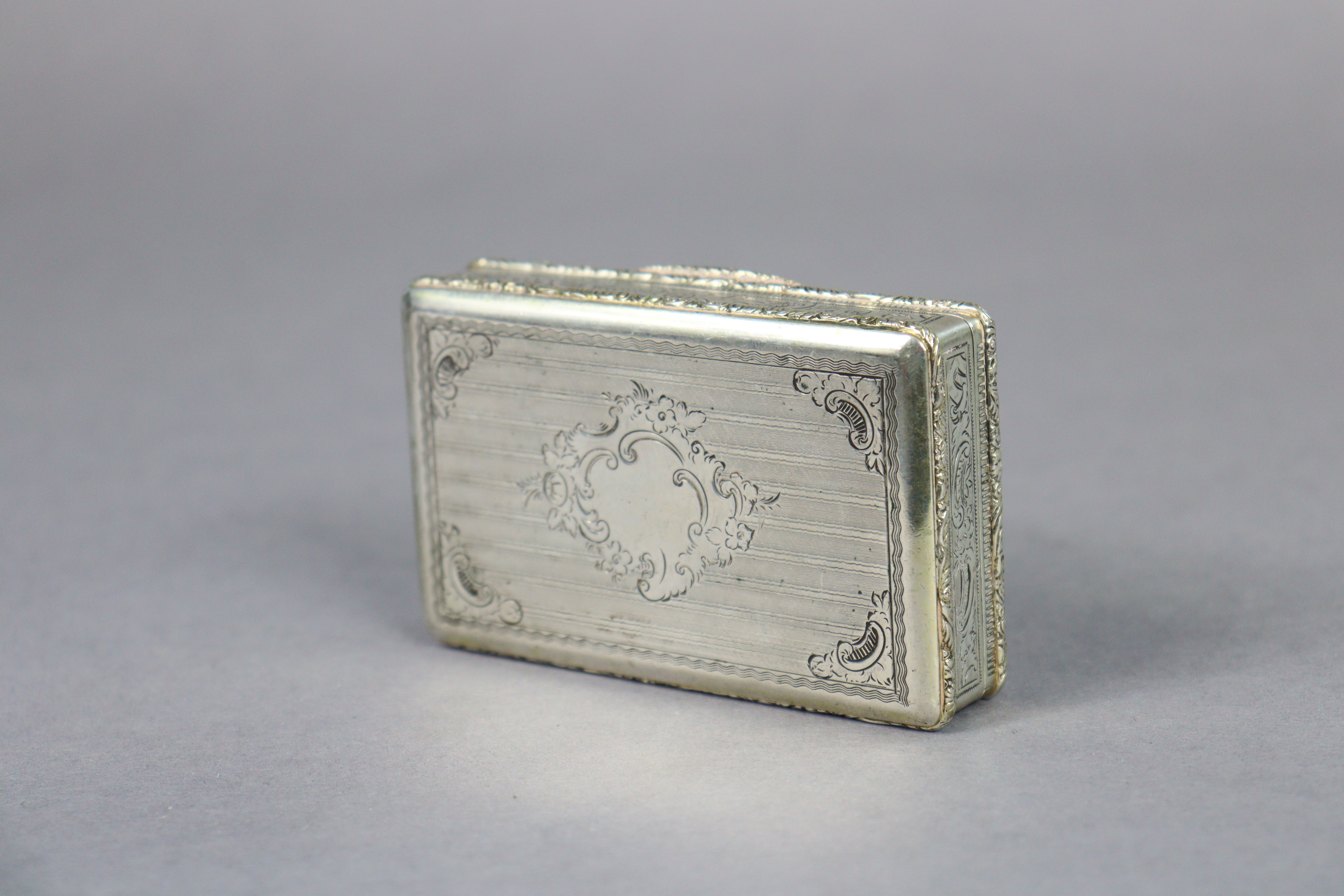 A mid-19th century Austro-Hungarian silver rectangular snuff box with all-over engraved floral & - Image 6 of 6