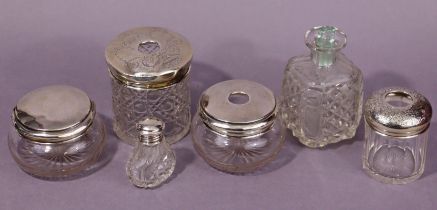 Five cut glass dressing table receptacles with silver lids/mounts; & another (un-mounted).
