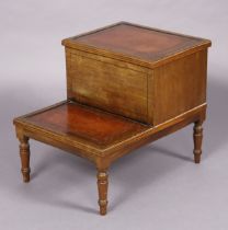 A pair of late 19th/early 20th century mahogany two-tread library steps, each inset gilt-tooled