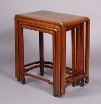 A late 19th/early 20th century Chinese hardwood nest of four rectangular occasional tables, with