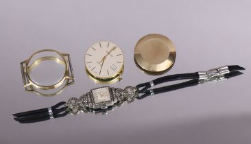 A Garrard 9ct gold gent’s wristwatch with quartz movement, the circular white dial with gold baton