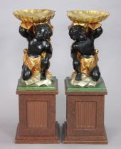 A pair of early 20th century Venetian polychrome figural stands, each supporting shell-shaped