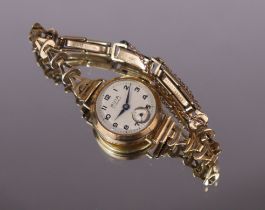 An Avia 9ct gold ladies’ bracelet watch, the white circular dial with Arabic numerals & subsidiary