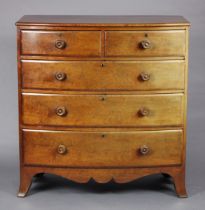 An early Victorian bow-front mahogany chest fitted two short & three long graduated drawers with