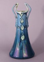 A Mintons Secessionist pottery two-handled vase, shape 3508, No.35, of blue ground with tube-lined