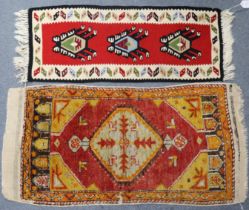 A small tribal mat of yellow ground with central medallion & floral motifs, 90cm x 45cm; and small