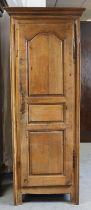 An 18th century oak narrow cupboard, with later adapted interior enclosed by a fielded panel door,
