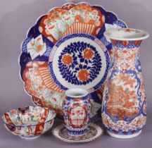 A late 19th century Japanese Imari slender baluster vase, 37cm; a ditto charger, 45cm; a small Imari